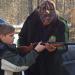 Jed showing Ben how to properly handle his firearm