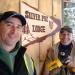 "Walking Tall" and "Hunter's Eye" installing the sign at Silver Fox Lodge in an advance of the dedication ceremony.
