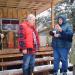 Karen anointing the "Silver Fox" with holy water at the dedication ceremony of Silver Fox Lodge.