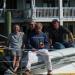 Beaufort, North Carolina, USA  Intrepid sailboat racers in the famed Caribbean ARC 1500 race showing their most prized possession while stopping for a break in the weather.